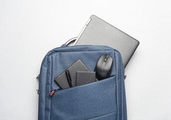 Modern gadgets For work and study. Backpack with laptop, notebook, external hard drive, pc mouse...