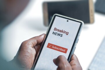 Man chose to subscribe to a digital newspaper update or breaking news. Selective focus.