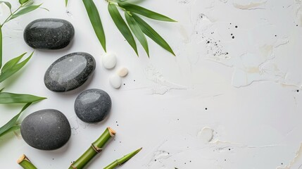 Banner for Mental Health Awareness Month featuring spa stones and bamboo on a light background viewed from above