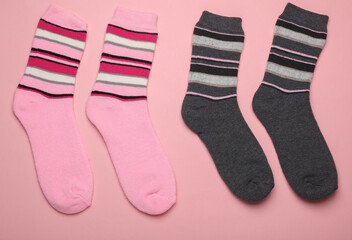 Socks on a pink background. Top view