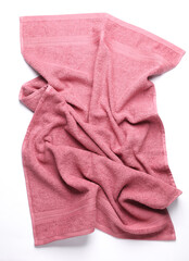 Pink crumpled towel on a white background