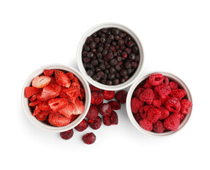 Bowls of dried berries on white background