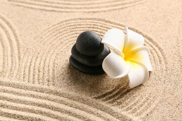 Stones and plumeria on sand. Zen concept