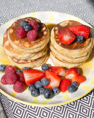 Pancakes with blueberries and strawberries