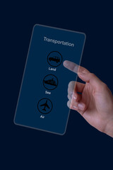 Hand pointing transportation preferences on a screen, on a dark background. Land, sea and air.
