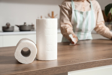 Rolls of paper towels on table in kitchen, closeup