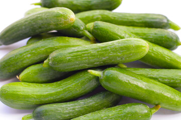 Mini cucumbers on white background.