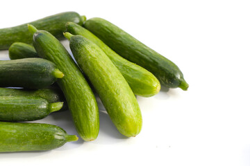 Mini cucumbers on white background.