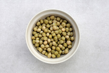 Canned green peas on white background.