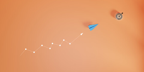 Blue paper plane isolated on orange background, concept of volatility in business and investment,...