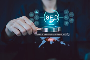 Women use magnifying glasses and computers for analysis of SEO, and search engine optimization...