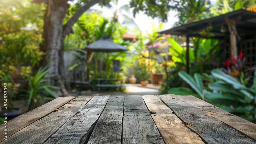 Wall mural wooden table space with green home backyard view blurred