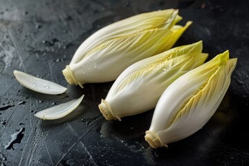 Fresh chicory on dark surface