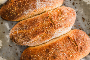 homemade rye bread baguettes on parchment paper