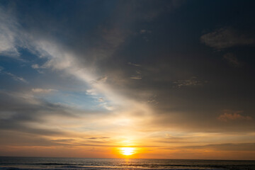 Obraz premium ocean with orange sky during sunset, for background purpose.