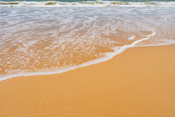 White foam waves breaking on the shore Close up