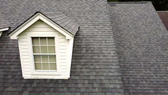 Video of new roof and old roof on house, showing comparison of the two.