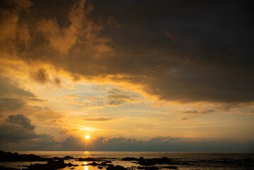 Fototapeta premium Beautiful red color sky. Red purple orange blue pink sunset cloud background. Concept holiday in the tropics