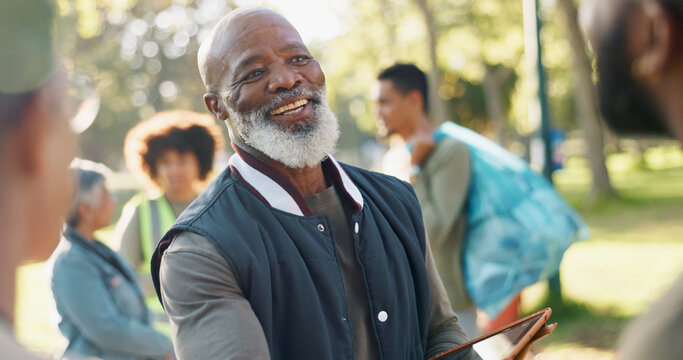 Park, black man and volunteers planning with tablet for support, community project or nature sustainability. Humanitarian, recycling or senior leader in charity service or NGO for pollution cleanup - Powered by Adobe