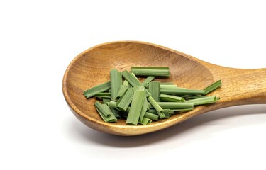 Lemongrass or Malabar Grass in a Wooden Spoon Isolated on White Background with Copy Space, Also...