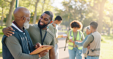 Park, people and volunteers success with tablet for data support, community project or nature...