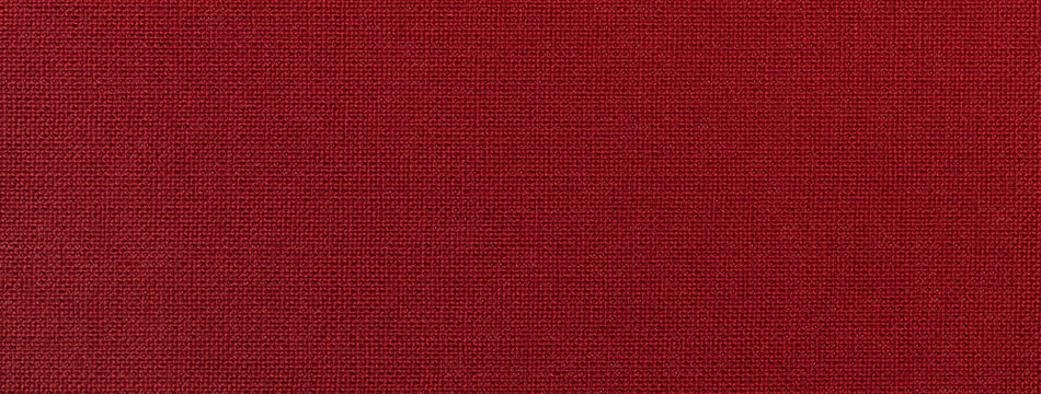 Dark red background from textile material with wicker pattern and texture, macro. Structure of wine fabric.