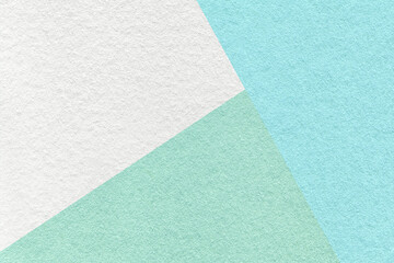 Fototapeta premium Texture of craft white, green and blue pastel color paper background, macro. Vintage abstract mint cardboard