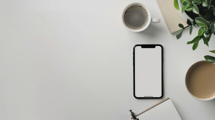 A minimalist flat lay of a smartphone, coffee cup, and notebook on a white table, with ample copy space.