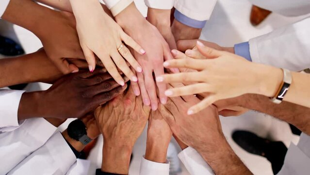 Medical Team Stacking Hands Against