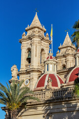 Fototapeta premium Majestic Zabbar Parish Church in Malta, a symbol of faith and heritage, standing tall against the evening sky at sunset. Cultural heritage of Malta