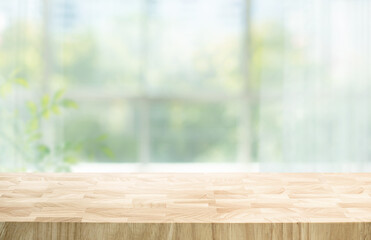 Selective focus.Wood table counter on blur curtain window in morning background.For montage product...