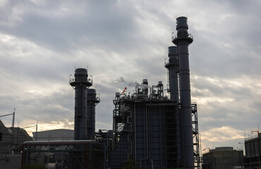 Gas turbine electrical power plant at dusk - factory - petrochemical plant