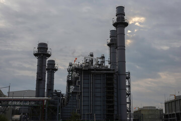 Gas turbine electrical power plant at dusk - factory - petrochemical plant