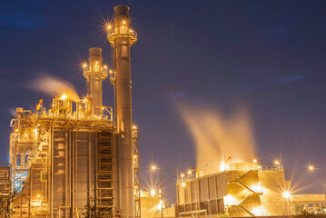 Gas turbine electrical power plant at dusk - factory - petrochemical plant