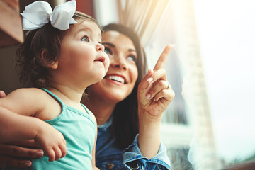 Mother, toddler and happy or home window, love and bonding with family in apartment together with...