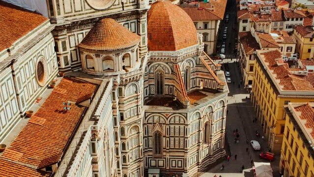 Florence seen from above, reveals a tapestry of picturesque architecture, weaving history and beauty under the Italian sun
