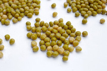 Canned green peas on white background.