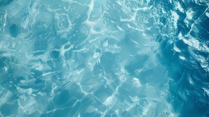 Fototapeta premium Blue water surface with bright sun light reflections background.