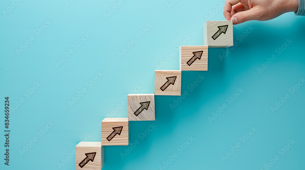 Poster hand stacking wooden blocks with arrow icons, illustrating growth on a blue background, concept of p