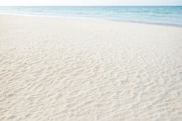 White Sand Beach With Blurred Ocean Background