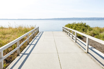 Fototapeta premium Concrete Pathway Leading to the Water
