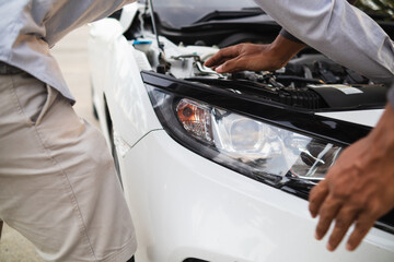 car service center mechanics are checking condition car and engine make sure they are ready use and...