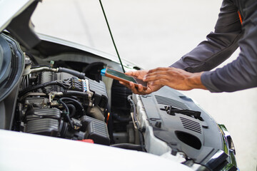 car service center mechanics are checking condition car and engine make sure they are ready use and...