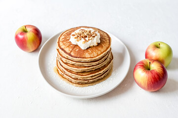 Stack of Pancakes with Whipped Cream and Pecans