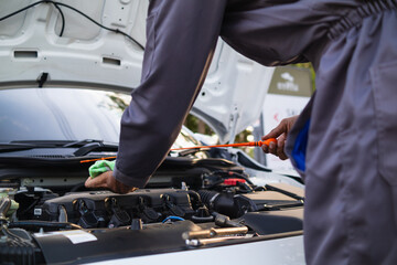 car service center mechanics are checking condition car and engine make sure they are ready use and...