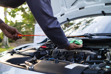 car service center mechanics are checking condition car and engine make sure they are ready use and in perfect condition according center warranty. periodic vehicle inspections for safety in driving.