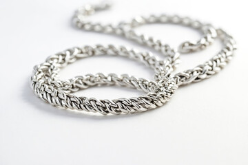 Closeup of a Silver Chain on a White Background