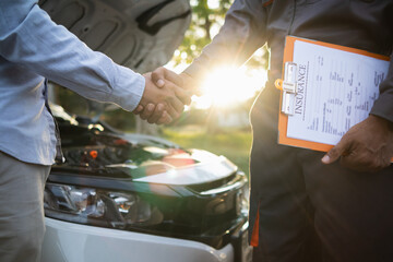 Technicians from service center inspect and assist customers cars that are having problems while...