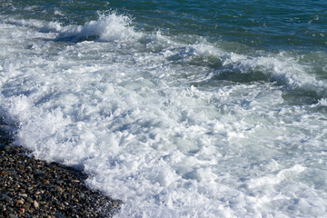 Sea wave crashing on the shore