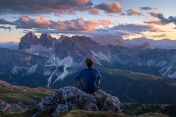 Fototapeta premium Man Enjoying Sunset View in Majestic Mountains
